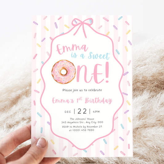 Sweet One donut first birthday invitation template for girls with pink donut, pastel sprinkles and pink stripes